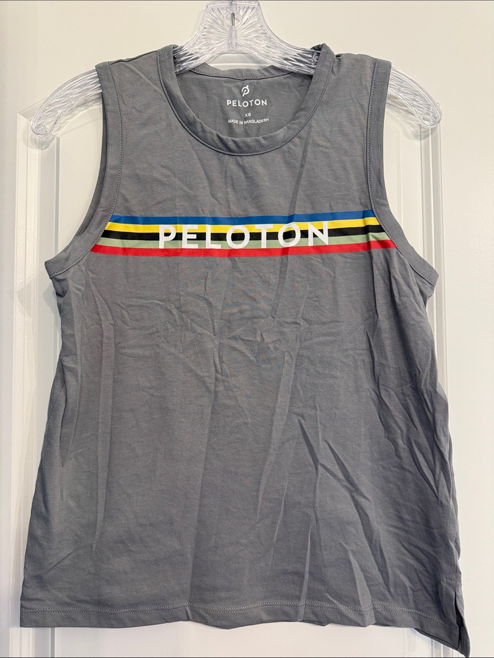 Peloton Gray Tank with Blue Yellow Black and Red Stripe Logo